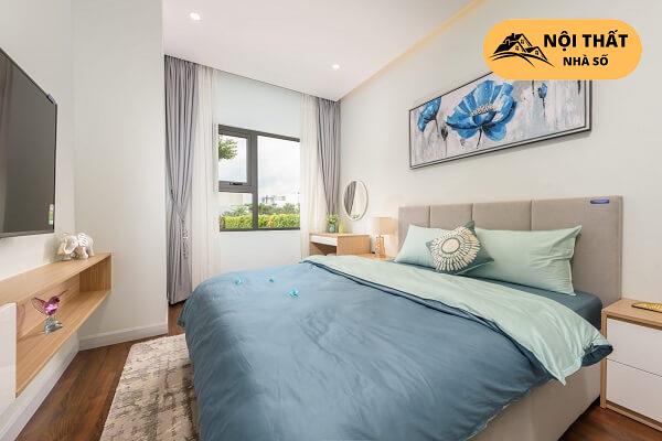 Phòng ngủ theo tone màu xanh dương như màu ghế Sofa của phòng khách tạo nên sự đồng bộ thống nhất