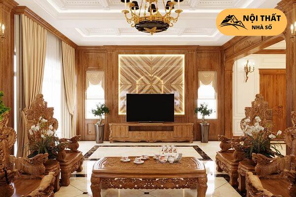 Phòng khách được sắp đặt bộ bàn ghế bằng gỗ được chạm khắc những hoa văn vô cùng tỉ mỉ và cực ký tinh tế