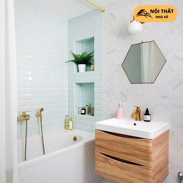 Ốp gạch màu xanh giúp phòng tắm trông mát hơn